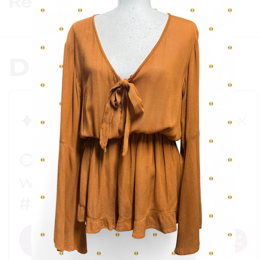 Nasty Gal gold/mustard long sleeve open front tie romper with ruffle detailing.